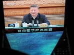 A giant screen shows news footage of  Chinese President Xi Jinping attending a symposium on private enterprises, at a shopping complex in Beijing, China, February 17, 2025. REUTERS/Florence Lo
