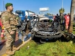 Lebanese army, security forces, and civil defence first responders inspect the remains of a destroyed vehicle that was reportedly hit by an Israeli strike in Lebanon's southern city of Sidon on February 17, 2025. Lebanese army, security forces, and civil defence first responders inspect the remains of a destroyed vehicle that was reportedly hit by an Israeli strike in Lebanon's southern city of Sidon on February 17, 2025.