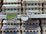 A sign for customers shopping for eggs at Trader Joe’s hangs by the cartons in Merrick, New York, February 16, 2025.