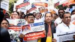 West Bengal BJP MLAs led by leader of Opposition Suvendhu Adhikari stage a protest against the state government over the Saraswati Puja issue in Kolkata on Monday. (ANI Photo)