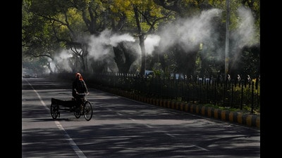 A man pedals his rickshaw as sprinklers attached to the street lamps spray water to settle down dust and air pollution in New Delhi, India, Wednesday, Feb. 12, 2025. (AP Photo/Manish Swarup) (AP) A man pedals his rickshaw as sprinklers attached to the street lamps spray water to settle down dust and air pollution in New Delhi, India, Wednesday, Feb. 12, 2025. (AP Photo/Manish Swarup) (AP)