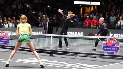 Steffi Graf (C) returns a volley as she and Andre Agassi play play a doubles match against Eugenie Bouchard (L) and Andy Roddick. (Getty Images via AFP) Steffi Graf (C) returns a volley as she and Andre Agassi play play a doubles match against Eugenie Bouchard (L) and Andy Roddick. (Getty Images via AFP)