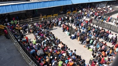  An aerial view of passengers waiting in queues at New Delhi Railway Station, in New Delhi on Monday. (ANI) An aerial view of passengers waiting in queues at New Delhi Railway Station, in New Delhi on Monday. (ANI)