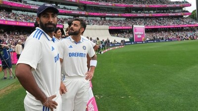 India's Jasprit Bumrah, left, and teammate Virat Kohli (AP) India's Jasprit Bumrah, left, and teammate Virat Kohli (AP)