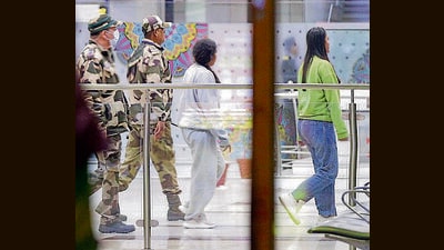 CISF personnel escort Indian citizens deported from the US, at Amritsar airport on Monday. (ANI) CISF personnel escort Indian citizens deported from the US, at Amritsar airport on Monday. (ANI)