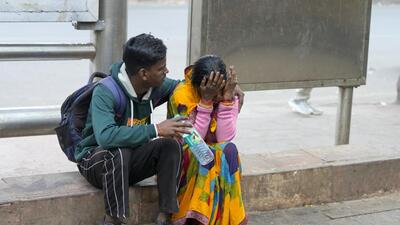 Grieving relatives of a deceased person outside the LNJP hospital on Sunday. (PTI) Grieving relatives of a deceased person outside the LNJP hospital on Sunday. (PTI)