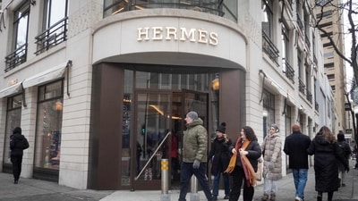 A sign hangs above the entrance of a Hermes retail store in Chicago, Illinois. (AFP) A sign hangs above the entrance of a Hermes retail store in Chicago, Illinois. (AFP)