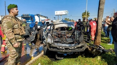Lebanese army, security forces, and civil defence first responders inspect the remains of a destroyed vehicle that was reportedly hit by an Israeli strike in Lebanon's southern city of Sidon on February 17, 2025. (AFP) Lebanese army, security forces, and civil defence first responders inspect the remains of a destroyed vehicle that was reportedly hit by an Israeli strike in Lebanon's southern city of Sidon on February 17, 2025. (AFP)
