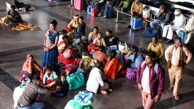 Passengers wait with their luggage at New Delhi Railway Station, in New Delhi on Monday. (Ishant ) Passengers wait with their luggage at New Delhi Railway Station, in New Delhi on Monday. (Ishant )