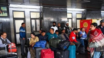 Passengers wait on platform with their luggage after the stampede. (ANI) Passengers wait on platform with their luggage after the stampede. (ANI)