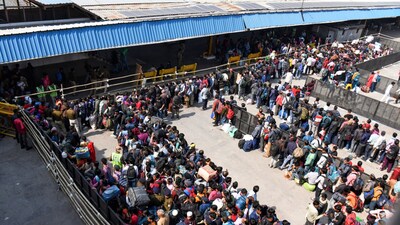 An aerial view of passengers waiting in queues at New Delhi Railway Station, in New Delhi on Monday. (ANI) An aerial view of passengers waiting in queues at New Delhi Railway Station, in New Delhi on Monday. (ANI)