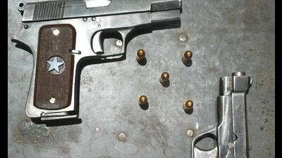 The seized firearms and cartridges in Bathinda. (HT photo)