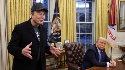 Elon Musk speaks next to US President Donald Trump in the Oval Office of the White House in Washington, DC (REUTERS)