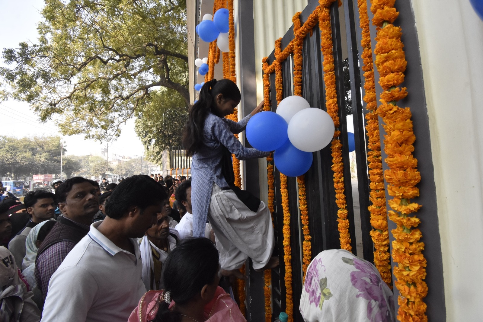 A girl student climbs an iron gate after coming late for the Bihar Board class 10th exam at Bankipur Girls' High School exam centre in Patna ( Photo by Santosh Kumar) A girl student climbs an iron gate after coming late for the Bihar Board class 10th exam at Bankipur Girls' High School exam centre in Patna ( Photo by Santosh Kumar)