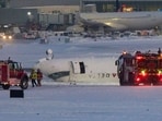 A Delta airlines plane sits on its roof after crashing upon landing at Toronto Pearson Airport in Toronto, Ontario, on February 17, 2025. A Delta Air Lines jet with 80 people onboard crash landed Monday at the Toronto airport, officials said, flipping upside down and leaving at least 15 people injured but causing no fatalities. A Delta airlines plane sits on its roof after crashing upon landing at Toronto Pearson Airport in Toronto, Ontario, on February 17, 2025. A Delta Air Lines jet with 80 people onboard crash landed Monday at the Toronto airport, officials said, flipping upside down and leaving at least 15 people injured but causing no fatalities.