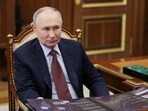 Russian President Vladimir Putin attends a meeting with Governor of Kamchatka Territory Vladimir Solodov in Moscow.