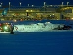 A Delta Airlines plane sits on its roof after crashing upon landing at Toronto Pearson Airport in Toronto, Ontario, on February 17, 2025. A Delta Airlines plane sits on its roof after crashing upon landing at Toronto Pearson Airport in Toronto, Ontario, on February 17, 2025.