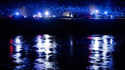 HAZARD, KENTUCKY - FEBRUARY 16: Law enforcement officers surround a vehicle that fell from a cliff near the North Fork Kentucky River on February 16, 2025 in Hazard, United States. Severe winter storms brought torrential rains causing intense flooding in Kentucky and parts of Florida and Georgia. Jon Cherry/Getty Images/AFP (Photo by Jon Cherry / GETTY IMAGES NORTH AMERICA / Getty Images via AFP) (Getty Images via AFP) HAZARD, KENTUCKY - FEBRUARY 16: Law enforcement officers surround a vehicle that fell from a cliff near the North Fork Kentucky River on February 16, 2025 in Hazard, United States. Severe winter storms brought torrential rains causing intense flooding in Kentucky and parts of Florida and Georgia. Jon Cherry/Getty Images/AFP (Photo by Jon Cherry / GETTY IMAGES NORTH AMERICA / Getty Images via AFP) (Getty Images via AFP)