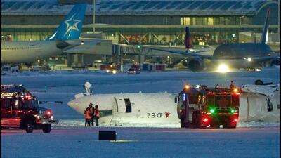 A Delta airlines plane sits on its roof after crashing upon landing at Toronto Pearson Airport in Toronto, Ontario, Canada, on Monday. (AFP) A Delta airlines plane sits on its roof after crashing upon landing at Toronto Pearson Airport in Toronto, Ontario, Canada, on Monday. (AFP)
