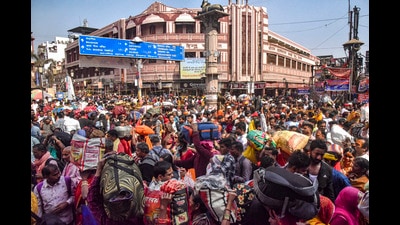 A crowd of devotees seen in a street, Varanasi. (PTI) A crowd of devotees seen in a street, Varanasi. (PTI)