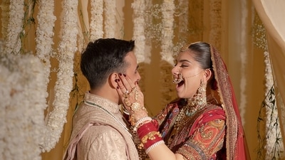 For the wedding, the bride opted for a red lehenga. Anuv, on the other hand, wore a beige sherwani. For the wedding, the bride opted for a red lehenga. Anuv, on the other hand, wore a beige sherwani.