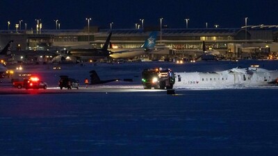 A Delta Airlines plane lies overturned after crashing earlier in the day at Toronto Pearson International Airport on February 17, 2025 in Toronto, (Photo by Katherine KY Cheng / GETTY IMAGES NORTH AMERICA / Getty Images via AFP) (Getty Images via AFP) A Delta Airlines plane lies overturned after crashing earlier in the day at Toronto Pearson International Airport on February 17, 2025 in Toronto, (Photo by Katherine KY Cheng / GETTY IMAGES NORTH AMERICA / Getty Images via AFP) (Getty Images via AFP)