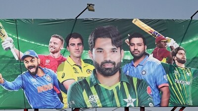 A billboard depicts Indian batsman Virat Kohli (L) and captain Rohit Sharma (3R) ahead of Champions Trophy in Karachi. (AFP)