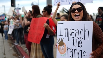 NORTH HOLLYWOOD, CALIFORNIA - FEBRUARY 17: Protesters rally against the Trump administration during a "Not My President's Day" protest on February 17, 2025 in North Hollywood, California. Protests are being held in cities across the nation on Presidents' Day against what the organizers say are "the anti-democratic and illegal actions of the Trump administration." Mario Tama/Getty Images/AFP (Photo by MARIO TAMA / GETTY IMAGES NORTH AMERICA / Getty Images via AFP) (Getty Images via AFP) NORTH HOLLYWOOD, CALIFORNIA - FEBRUARY 17: Protesters rally against the Trump administration during a "Not My President's Day" protest on February 17, 2025 in North Hollywood, California. Protests are being held in cities across the nation on Presidents' Day against what the organizers say are "the anti-democratic and illegal actions of the Trump administration." Mario Tama/Getty Images/AFP (Photo by MARIO TAMA / GETTY IMAGES NORTH AMERICA / Getty Images via AFP) (Getty Images via AFP)