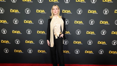 Elle Fanning attended the 77th Annual Directors Guild of America Awards in Beverly Hills, California in an ivory white silk skirt, and a black suit. However, the matching bow at the waist didn't quite add up to the look. (REUTERS/Mario Anzuoni)