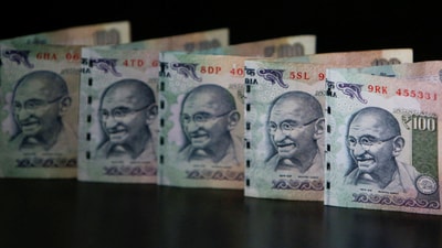 Due to persistent outflows of foreign funds and an increase in the US dollar index, the rupee lost 8 paise to settle at 86.96 (provisional) versus the US dollar. (REUTERS//Vivek Prakash)