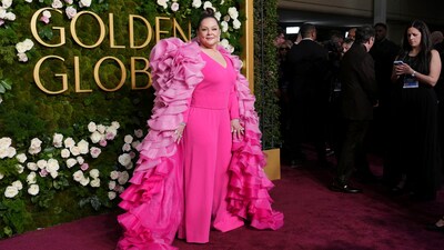 Melissa McCarthy wore a pink overall with a pink ruffled cape. (Photo by Jordan Strauss/Invision/AP) Melissa McCarthy wore a pink overall with a pink ruffled cape. (Photo by Jordan Strauss/Invision/AP)