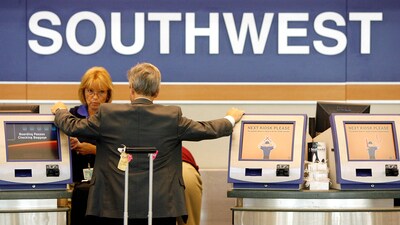 FILE PHOTO: A passenger waits at the Southwest Airlines ticket counter at Midway Airport in Chicago, Illinois July 24, 2008. (REUTERS)