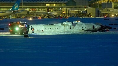 A Delta Airlines plane sits on its roof after crashing upon landing at Toronto Pearson Airport in Toronto, Ontario, on February 17, 2025. (AFP) A Delta Airlines plane sits on its roof after crashing upon landing at Toronto Pearson Airport in Toronto, Ontario, on February 17, 2025. (AFP)