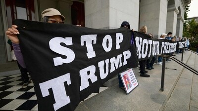 Demonstrators rally against US President Donald Trump during a protest, part of the �50 States 50 Protests 1 Day� movement, to mark President's Day on February 17, 2025 in Sacramento, California. (Photo by FRED GREAVES / AFP) (AFP) Demonstrators rally against US President Donald Trump during a protest, part of the �50 States 50 Protests 1 Day� movement, to mark President's Day on February 17, 2025 in Sacramento, California. (Photo by FRED GREAVES / AFP) (AFP)