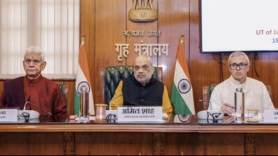 Union home minister Amit Shah chairs a review meeting with J&K lieutenant governor Manoj Sinha and chief minister Omar Abdullah on the implementation of three new criminal laws in the Union Territory, in Delhi on Tuesday. (@PIBHomeAffairs)