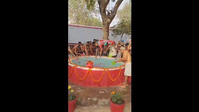 Unnao jail inmates bathed with holy water from the Triveni Sangam. (Sourced) Unnao jail inmates bathed with holy water from the Triveni Sangam. (Sourced)