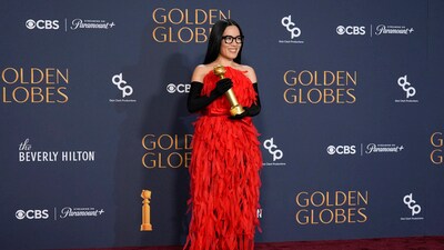 Ali Wong attended the 82nd Golden Globes Awards in a bright red dress featuring frills. However, the black opera-length gloves looked mismatched. (AP Photo/Chris Pizzello) Ali Wong attended the 82nd Golden Globes Awards in a bright red dress featuring frills. However, the black opera-length gloves looked mismatched. (AP Photo/Chris Pizzello)