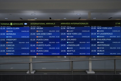 Sign boards list delayed and cancelled flights inside the arrivals hall of Terminal 3 after a Delta Air Lines plane crash at Toronto Pearson International Airport in Mississauga, Ontario, Canada, February 17, 2025. (Reuters)