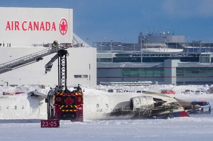 First responders work at the Delta Air Lines plane crash site at Toronto Pearson International Airport in Mississauga, Ontario, Canada February 17, 2025. (Reuters)