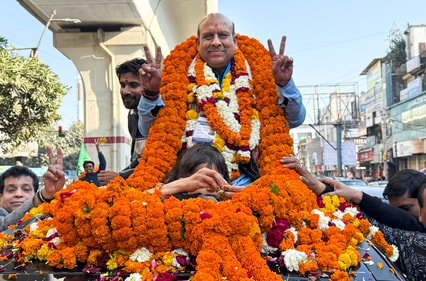 BJP leader Vijender Gupta celebrates after winning in the Delhi assembly poll in Delhi. (PTI) BJP leader Vijender Gupta celebrates after winning in the Delhi assembly poll in Delhi. (PTI)