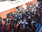 Passengers jostle at Patna railway station to catch a train to Prayagraj for Mahakumbh.(Santosh Kumar/HT Photo)