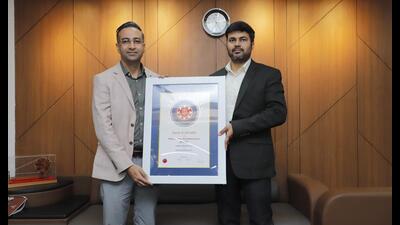 Devansh Yadav (right), CEO of Jammu Smart City Limited, receives SKOCH award at a ceremony in New Delhi. (HT photo)