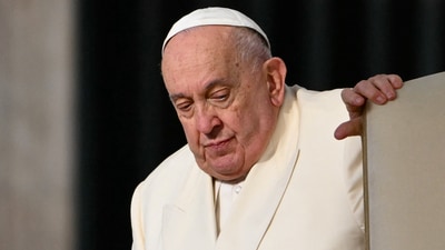 Pope Francis, who has been diagnosed with pneumonia in both lungs, passed a "peaceful night" at the Gemelli hospital, the Vatican said on February 19, 2025, amid growing concerns over the 88-year-old's condition. (Photo by Alberto PIZZOLI / AFP) (AFP)