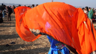A pilgrim holds up her sari to dry after a holy dip at the confluence of the Ganges, the Yamuna and the mythical Saraswati rivers during Maha Kumbh festival in Prayagraj (AP/Rajesh Kumar Singh) A pilgrim holds up her sari to dry after a holy dip at the confluence of the Ganges, the Yamuna and the mythical Saraswati rivers during Maha Kumbh festival in Prayagraj (AP/Rajesh Kumar Singh)