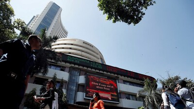 Sensex, Nifty 50 today: People walk past the Bombay Stock Exchange (BSE) building in Mumbai, India, March 9, 2020 (Francis Mascarenhas/Reuters)