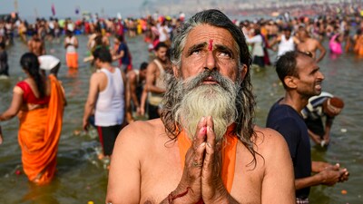A devotee performs rituals after taking a holy dip during the Mahakumbh Mela at the Sangam in Prayagraj, (PTI) A devotee performs rituals after taking a holy dip during the Mahakumbh Mela at the Sangam in Prayagraj, (PTI)
