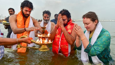 Deputy Chief Minister of Andhra Pradesh Pawan Kalyan with his family prays after taking a holy dip at Sangam during the ongoing Maha Kumbh Mela festival, in Prayagraj (PTI) Deputy Chief Minister of Andhra Pradesh Pawan Kalyan with his family prays after taking a holy dip at Sangam during the ongoing Maha Kumbh Mela festival, in Prayagraj (PTI)
