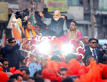 Union home minister Amit Shah waves to the crowd during a roadshow in support of BJP's candidate from Shalimar Bagh assembly constituency, Rekha Gupta for the Delhi assembly election in New Delhi. (Amit Shah-X) Union home minister Amit Shah waves to the crowd during a roadshow in support of BJP's candidate from Shalimar Bagh assembly constituency, Rekha Gupta for the Delhi assembly election in New Delhi. (Amit Shah-X)