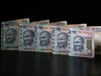 FILE PHOTO: Indian Rupee notes are seen in this picture illustration taken in Mumbai June 12, 2013. REUTERS/Vivek Prakash/File Photo