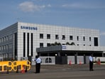 Security guards stand outside a Samsung facility during a strike by the factory workers demanding higher wages in Sriperumbudur, near the city of Chennai, India, September 16, 2024. 